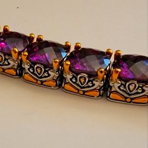 This is a strong sterling silver Size 8.5 rich purple stone bracelet.